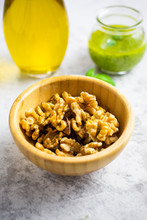 Bowl Of Walnuts, Pesto And Olive Oil In Background
