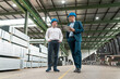 © Westend61 - Two businessmen talking in a factory