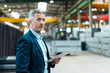 © Westend61 - Mature businessman holding tablet in a factory