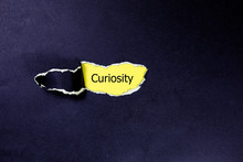 Curiosity Word Under Torn Paper