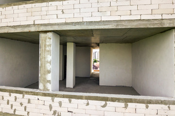 Canvas Print - Rooms interior of new apartment building facade under construction.