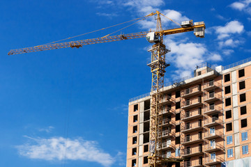 crane with office buildings in the background