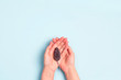© WindyNight - Female hands with a laboratory mouse on a blue background. Stop the cruelty. Stop animal testing.