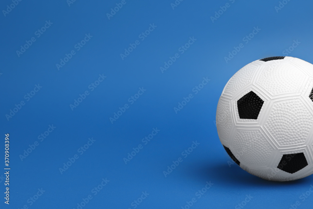 Soccer ball on color background