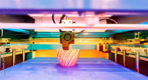 3D printer or additive manufacturing and robotic automation technology