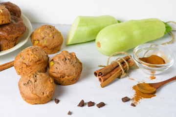 chocolate muffins with zucchini and banana. wet veggie cupcakes home-made, top view on a light background. cooking muffins in the kitchen. vegan bread for healthy eating