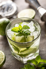 Wall Mural - Mojito cocktail drink with white rum lime mint herbs and soda on the bar counter