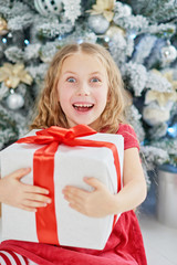 gift, christmas, present, child, tree, holiday, xmas, girl, happy, kid, celebration, decoration, happiness, year, new, home, caucasian, red, winter, people, box, beautiful, little, surprise, person, c