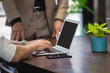 © eakgrungenerd - close up businessmen using laptop on table at office. Teamwork successful meeting concept.