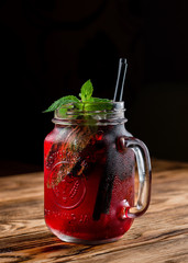 Poster - red lemonade in a mug on the table