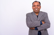 © Ranta Images - Portrait of happy mature overweight Indian businessman in suit