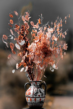 Jar With Dried Plants In Blurry Background. Bouquet With Dried Flowers...