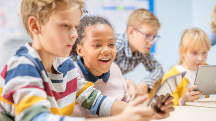 Poster - Elementary School Computer Science Class: Children Use Digital Tablet Computers and Smartphones with Augmented Reality Software, They’re Excited, Full of Wonder. Children in STEM, Playing and Learning