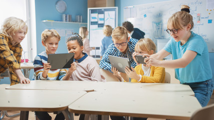 Poster - Elementary School Computer Science Class: Children Use Digital Tablet Computers and Smartphones with Augmented Reality Software, They’re Excited, Full of Wonder. Children in STEM, Playing and Learning