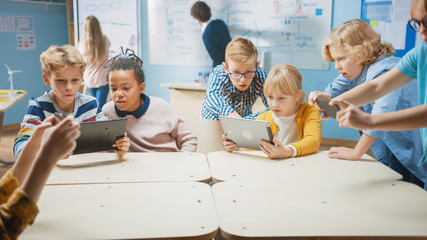 Poster - Elementary School Computer Science Class: Children Use Digital Tablet Computers and Smartphones with Augmented Reality Software, They’re Excited, Full of Wonder. Children in STEM, Playing and Learning