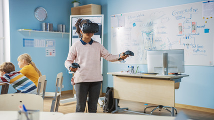 Wall Mural - Elementary School Computer Science Class: Cute Girl Wearing Augmented Reality Headset and Using Controllers Learns Lessons in Virtual Reality Excited, Curious and Interested in Knowledge