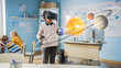 © Gorodenkoff - Cute Girl Wearing Augmented Reality Headset and Using Controllers Interacts with 3D Solar System. Futuristic School Science Class for Children Learning in STEM Programs. VFX, Special Effects Render