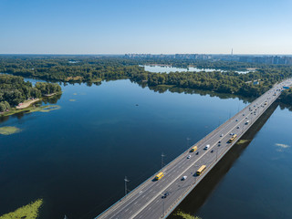 Aerial drone view. Cars travel along the North Bridge across the Dnieper in Kiev.