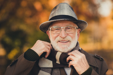 Canvas Print - Closeup photo of cheerful glad retired old grey haired grandpa central park walk enjoy sunny day weather toothy smiling wear stylish autumn jacket hat scarf specs colorful street outside