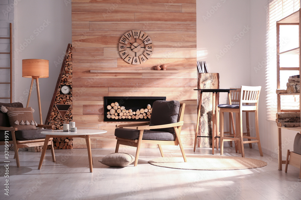 Obraz na płótnie Decorative fireplace with stacked wood in cozy living room interior w salonie