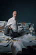 © stokkete - Disappointed business executive standing in his messy office