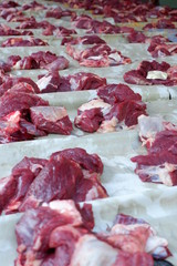 Wall Mural - Fresh red beef is cut into small pieces to celebrate the Muslim holiday, Eid al-Adha