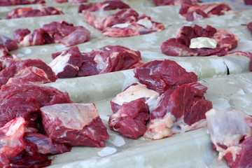 Fresh red beef is cut into small pieces to celebrate the Muslim holiday, Eid al-Adha