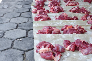 Wall Mural - Fresh red beef is cut into small pieces to celebrate the Muslim holiday, Eid al-Adha