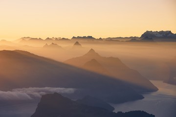 Poster - Scenic view of lake and mountains at sunrise