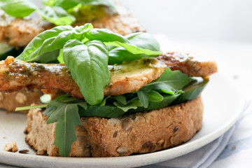 Ready to eat sandwich with grilled chicken meat and basil pesto