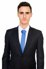 Studio shot of young handsome Caucasian businessman isolated against white background