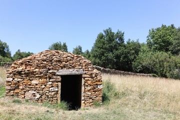 Wall Mural - Old and typical stone hut called caborne in french language in Saint Cyr au Mont d'or, France