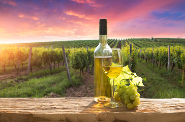 A fresh chilled glass of ice wine overlooking a Canadian vineyard during a Summer sunset