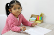 © Arlette - 3-year-old Latin girl with school supplies at the beginning of classes