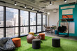 © Mumemories - Creative room coworking space with cushions and chairs on artificial grass in office