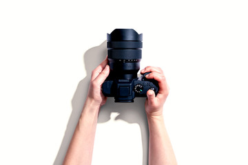 Poster - Person holding a SLR camera from above