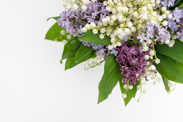 Wall Mural - Fresh lily of the valley and lilac bouquet