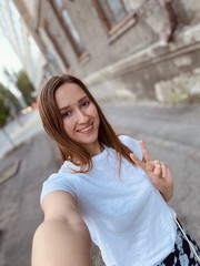 Wall Mural - Beautiful young blonde fit girl in the old town