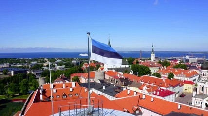 Wall Mural - Estonian flag on Tall Hermann Tower in the Old Town of Tallinn, Estonia