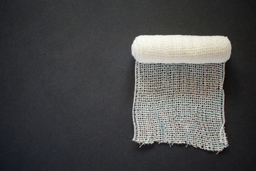 white medical bandage on black background