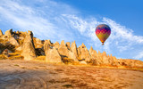 Fototapeta  - Hot air balloon flying over spectacular Cappadocia