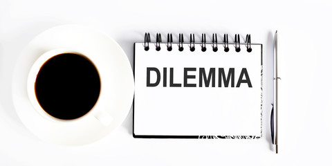 Poster - DILEMMA , planning concept. Spiral notebook with text on white background with coffee