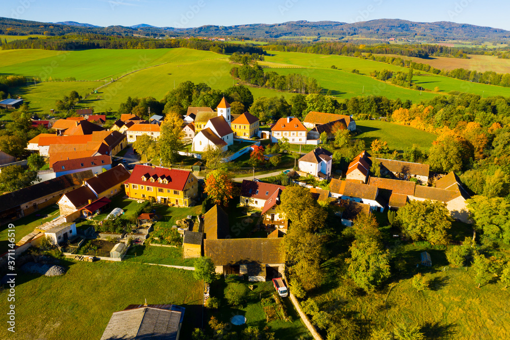 Autumnal aerial landscape of czech village Cakov with Church of Saint Leonard in autumn day - obrazy, fototapety, plakaty 