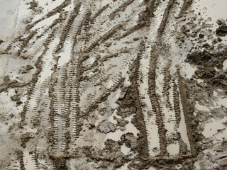 Canvas Print - wheel tracks in mud on the road after rain