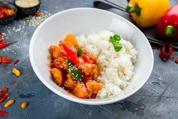 Wall Mural - Pork in sweet and sour sauce with rice, chinese cuisine
