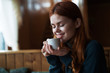 © SHOTPRIME STUDIO - Woman sitting in cafe with closed eyes cup of drink leisure lifestyle