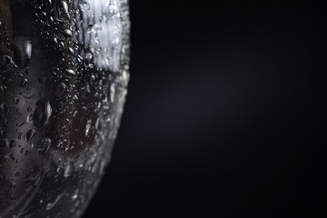 Large and fine water drops on glass.