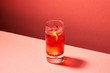 © 365mm/Stocksy - Tasty red drink with ice and oranges