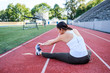 © Take A Pix Media/Stocksy - Mixed Race Woman Stretching Before Exercise