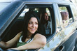 © JImena Roquero/Stocksy - Mother and two teenage daughters on a car